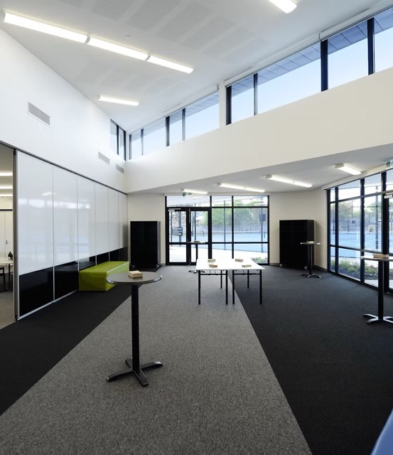 Eagle Room with a glass partition wall and large windows